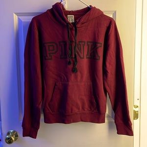 Pink hooded sweatshirt.